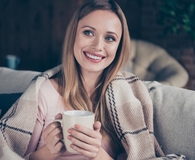 Woman cozy at home with essentials
